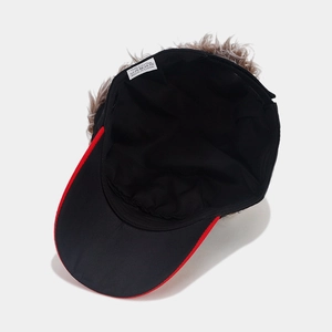 Detail view of cotton baseball cap interior showing the label and synthetic hair attachment
