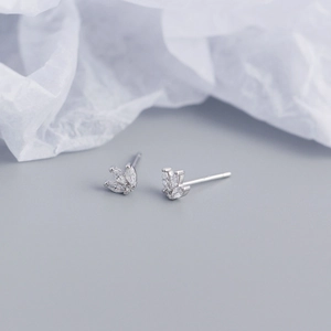 Macro shot of silver butterfly stud earrings with marquise-cut marquise zircon stones