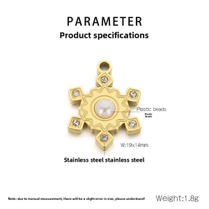 Detailed view of a gold stainless steel snowflake pendant with pearls and crystals