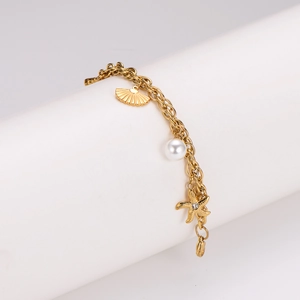 Golden ocean style bracelet with starfish shell and pearl charms on round link chain