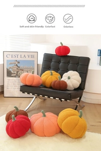 Detailed texture of colorful plush pumpkin pillows on a modern leather sofa