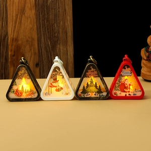 Set of four vintage Christmas LED lanterns with warm glow and festive holiday patterns