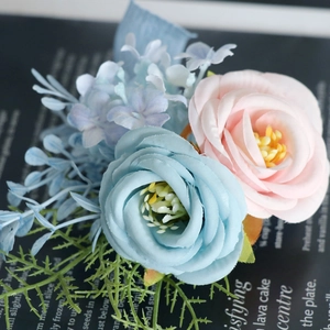 Elegant pink and light blue artificial rose boutonnieres for groom and wedding guests
