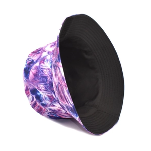 Detail view of tie-dye bucket hat featuring purple and blue marble pattern with black lining