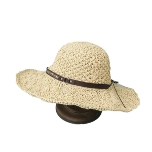 Women's wide brim straw sun hat with ethnic belt and metal ring for beach vacations