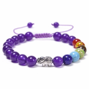 Detail of adjustable beaded bracelet with silver elephant and colorful chakra gemstones
