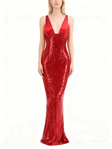 Detail of deep V-neckline with satin fabric and red sequins on evening gown