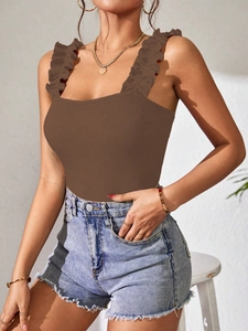 Detailed texture of brown ribbed knit bodysuit featuring ruffled wide shoulder straps