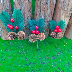 Artificial pine branches with pine cones and red berries for Christmas decoration
