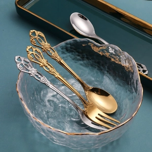 Set of vintage European embossed stainless steel dessert spoons and fruit forks