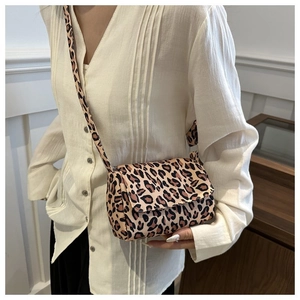 Leopard print crossbody bag worn by a model showing the actual size and fit