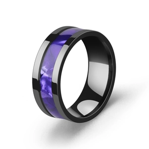 Detail of black stainless steel ring with polished finish and purple shell inlay band