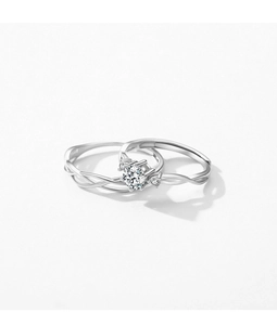 Macro shot of silver Moebius ring set with a sparkling round diamond and twisted band