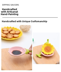Macro detail of handmade ceramic floral dipping saucer with green leaf handle