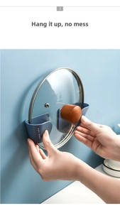Detail of wall-mounted blue pot lid rack showing sturdy support and practical usage