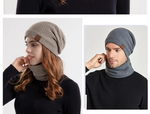 Detailed texture of thick knitted winter hat and neck warmer set with leather patch