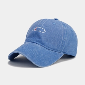 Detail of blue washed cotton baseball cap with creative 1% low battery embroidery
