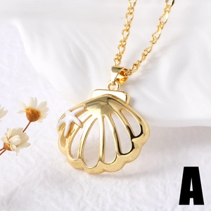 Elegant gold shell and starfish pendant necklace for women on a textured white background