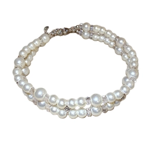 Double-layered white pearl bracelet with sparkling rhinestone spacers and lobster clasp