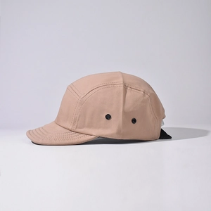 Detail view of khaki 5-panel camper hat featuring metal eyelets and premium stitching