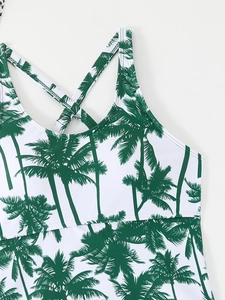 Detail of tropical palm tree print tankini top with thin criss-cross shoulder straps