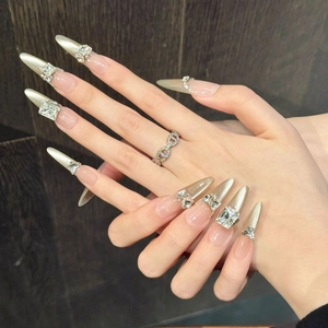 Detailed view of handmade luxury champagne cat eye nails with sparkling K9 crystals