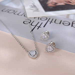 Silver stainless steel heart necklace and earrings set with sparkling zircon crystals