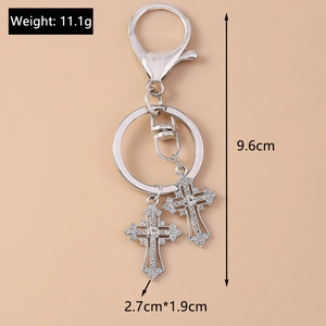 Detail shot of silver gothic keychain with rhinestone crosses and size dimensions
