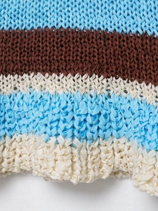 Close-up of blue, brown and cream striped knit top with openwork texture details