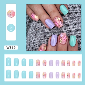 Macro view of W869 press-on nails set featuring light blue, purple and pink floral patterns