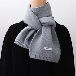 Classic grey knitted winter scarf for men and women featuring soft texture and woven label