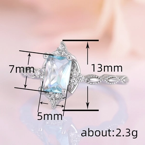 Elegant crown princess ring with blue gemstone and twisted silver band, 7x5mm stone