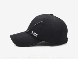 Detail view of black breathable mesh baseball cap with side FASHION lettering and silver accents