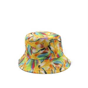 Close-up of a double-sided bucket hat with vibrant abstract floral print for sun protection