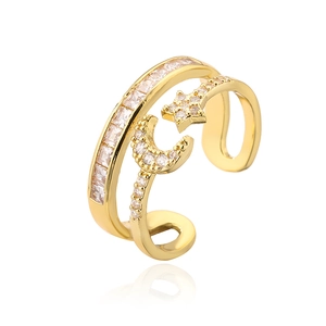 Detail of 18K gold-plated double-layer ring featuring pavé zircon star and moon motifs
