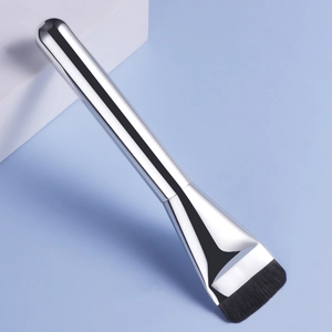 Professional flat foundation brush with silver metal handle and black bristles