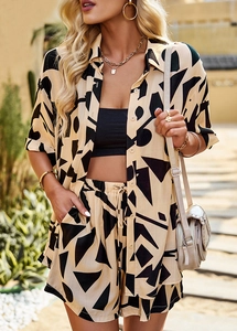Detail of beige and black abstract print on summer shirt and shorts co-ord set