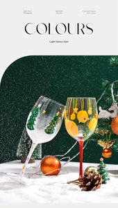 Close-up of hand-painted Christmas tree and festive ornaments on wine glasses