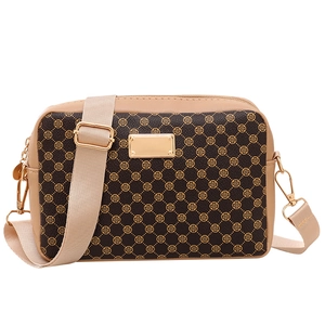 Vintage pattern crossbody bag in brown and beige with clover print and gold hardware