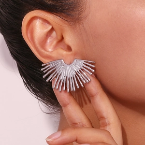 Silver radiant sunburst fan stud earrings in stainless steel on ear model