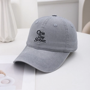 Detail shot of One Day Sober embroidery on grey cotton twill vintage baseball cap
