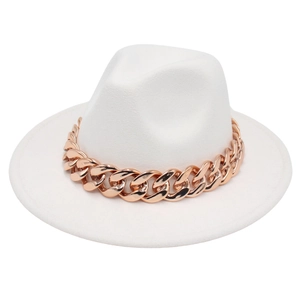 Close-up of white wool fedora with chunky rose gold acrylic chain on a flat surface