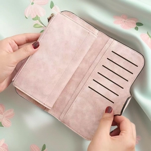 Vintage long wallet for women in dusty pink suede featuring multi-card slots and zipper