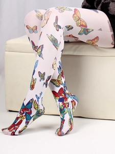 Detail of white patterned tights featuring colorful butterfly print on a smooth fabric