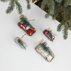 Miniature Christmas car ornaments with tiny trees and rope hangers in festive colors