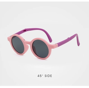 Detail of pink and purple kids sunglasses showing the 45 degree side view frame