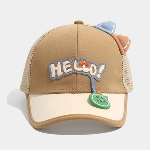 Detail of kids mesh cap with HELLO patch, cartoon dinosaur charm, and 3D ears