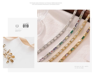 Detail of elegant tennis bracelet with colorful rectangular cubic zirconia in gold and silver