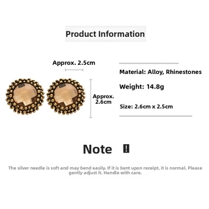 Detail view of retro flower earrings with amber rhinestone and vintage gold texture