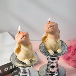 Macro shot of Easter bunny scented candle with detailed fur texture and warm lit flame